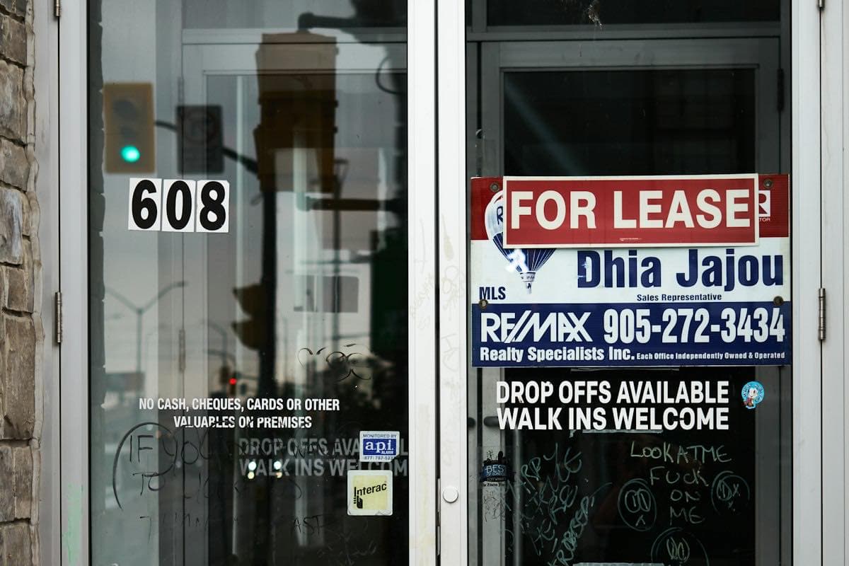 A for-lease sign on commercial glass doors