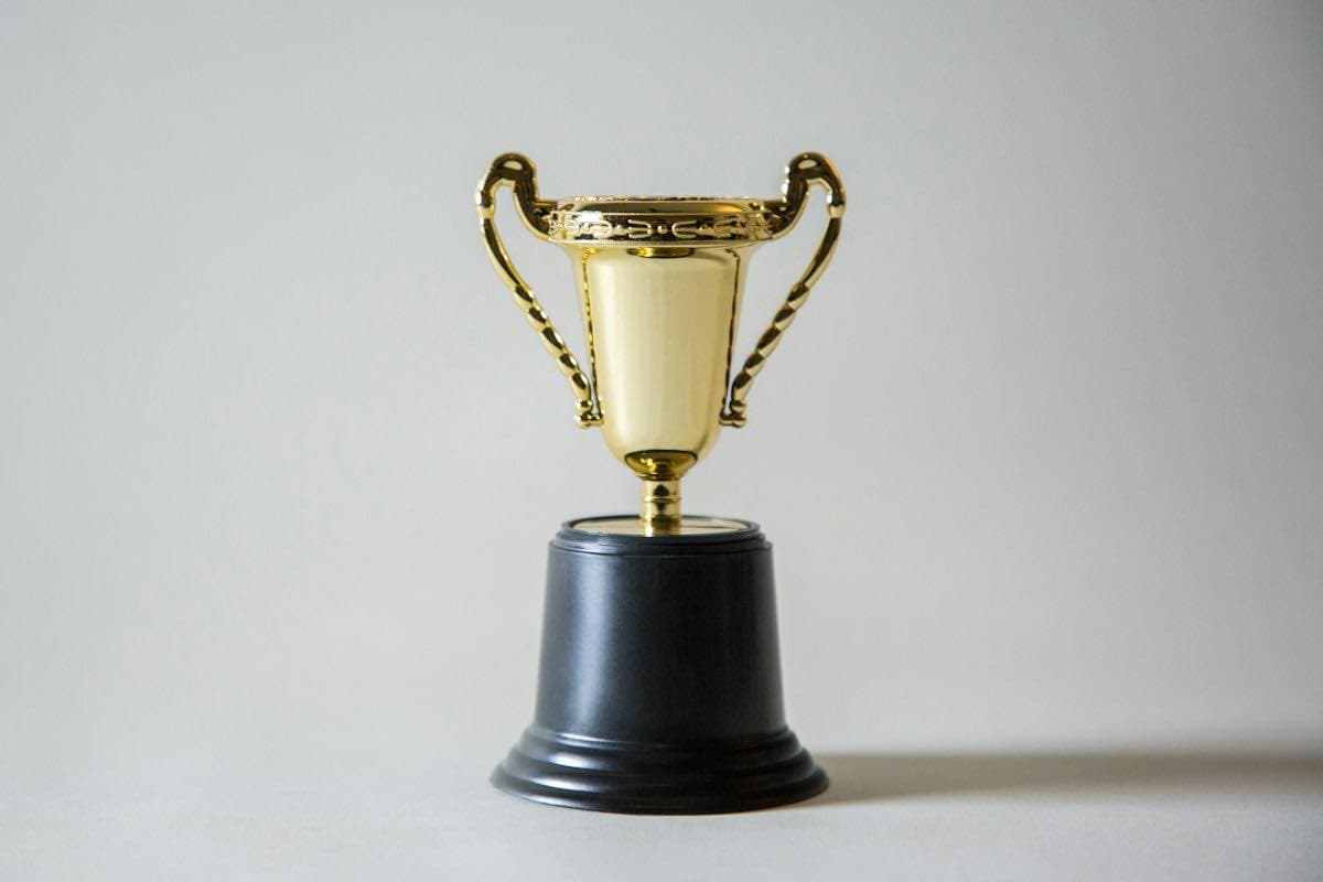 A gold trophy on a table