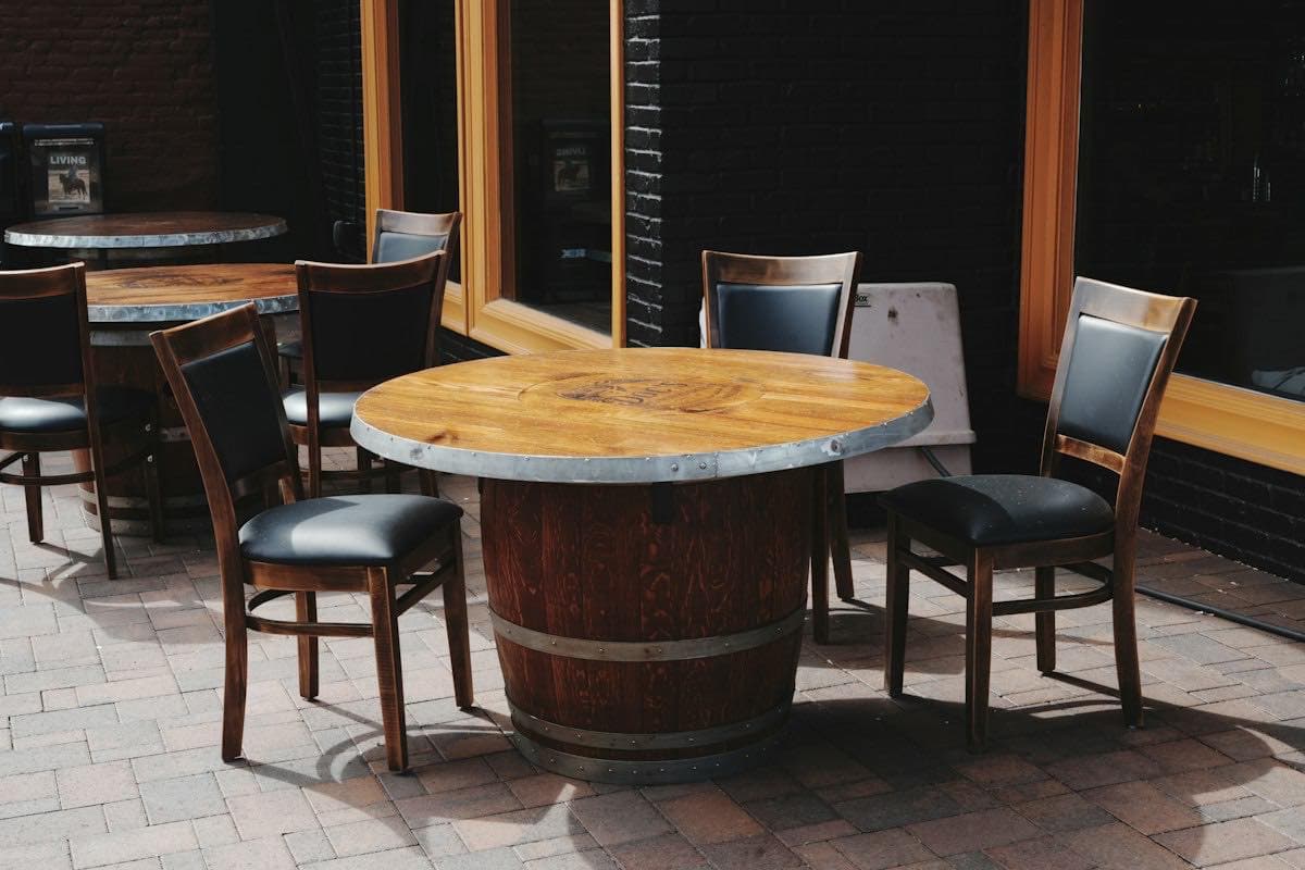Outdoor dining tables on a brick patio