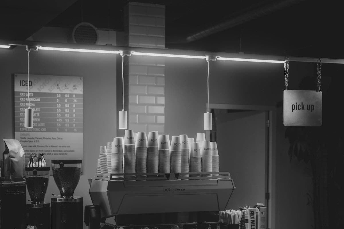 A coffee shop counter with an espresso machine