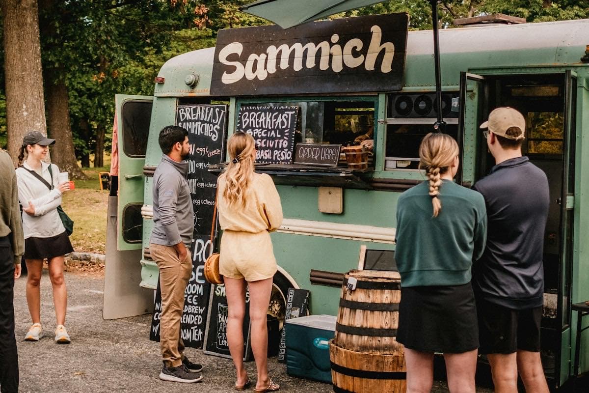 People lined up at a food truck