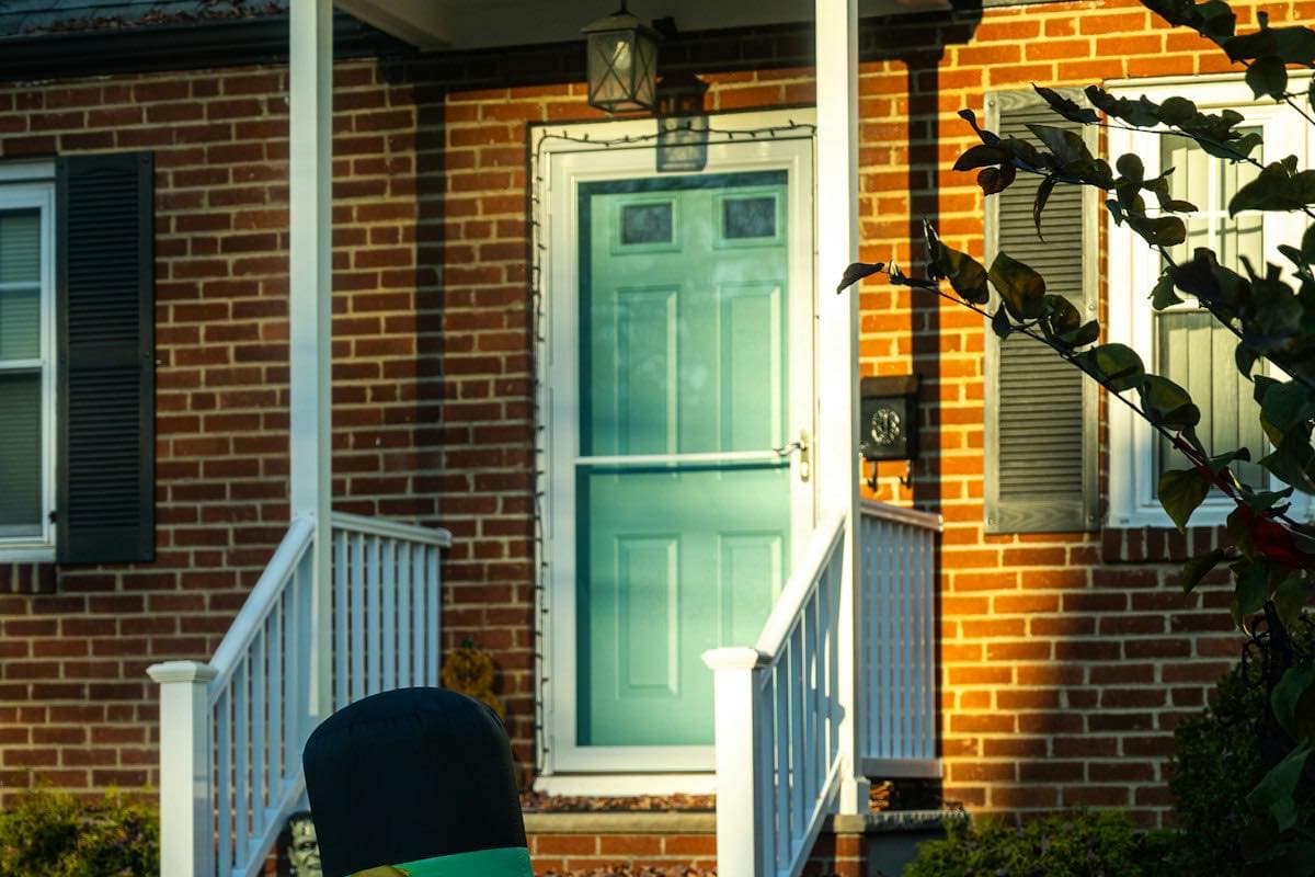 Halloween decorations in front of a brick house