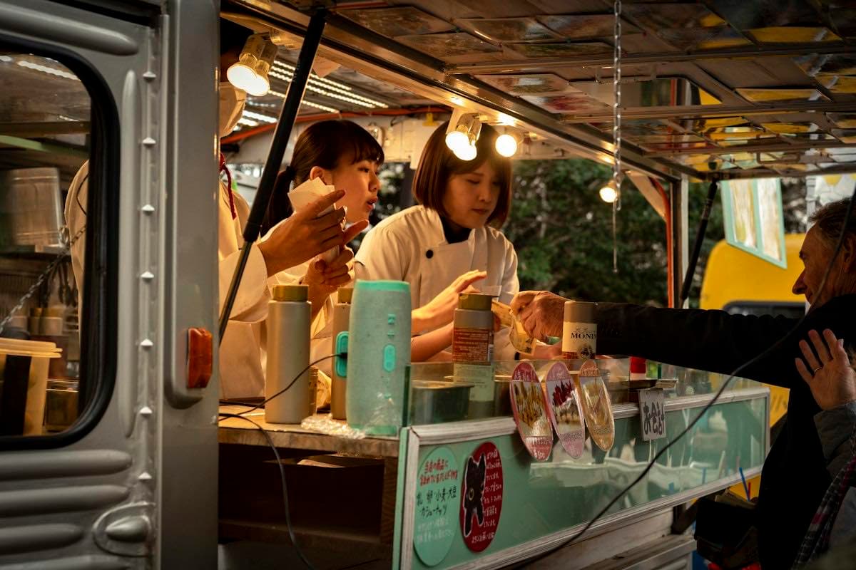 A crowd gathered around a food truck
