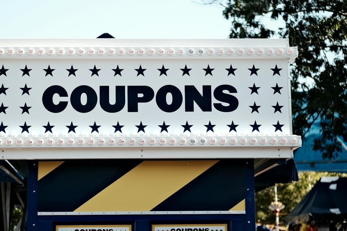 A sign that says coupons